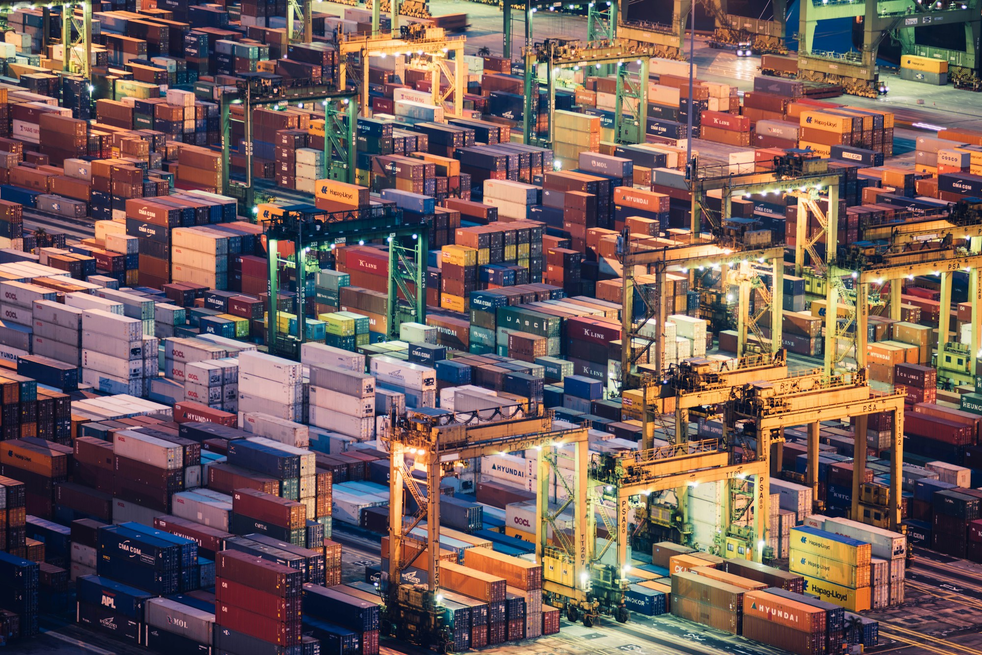 Shipping containers and cranes at a working container terminal